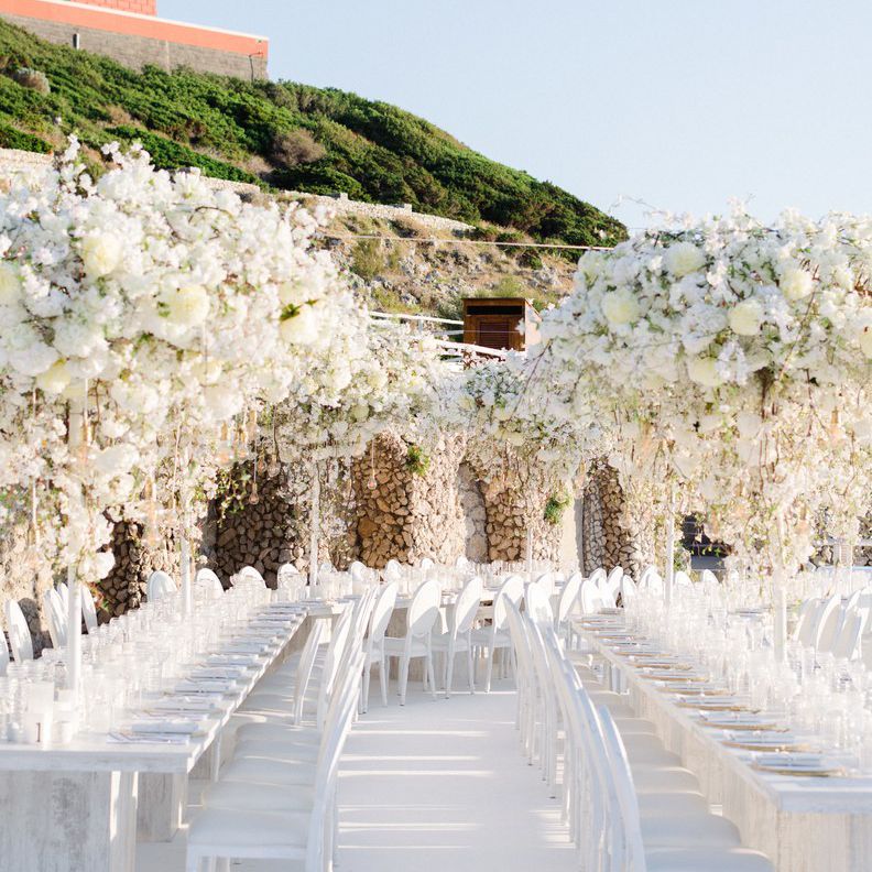 Massive cascading white floral installations at reception