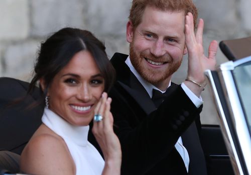 Prince Harry and Meghan Markle depart for their evening wedding reception.